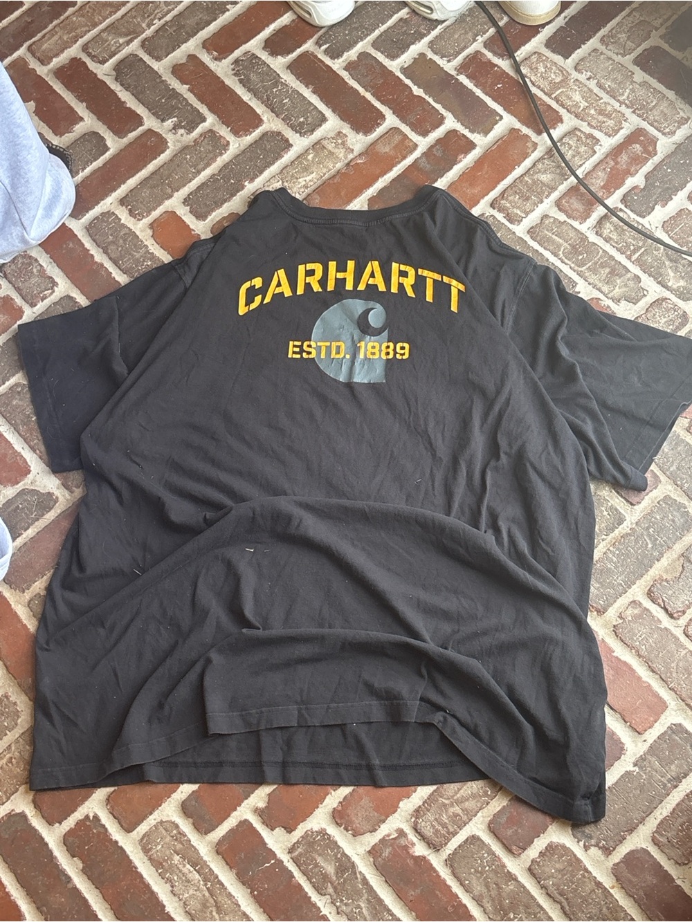 Vintage Carhartt Black Short-Sleeve Tee with Yellow Logo